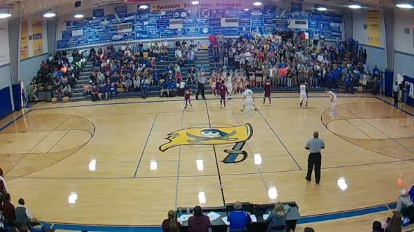 Fairhope High School basketball game in a packed gymnasium.
